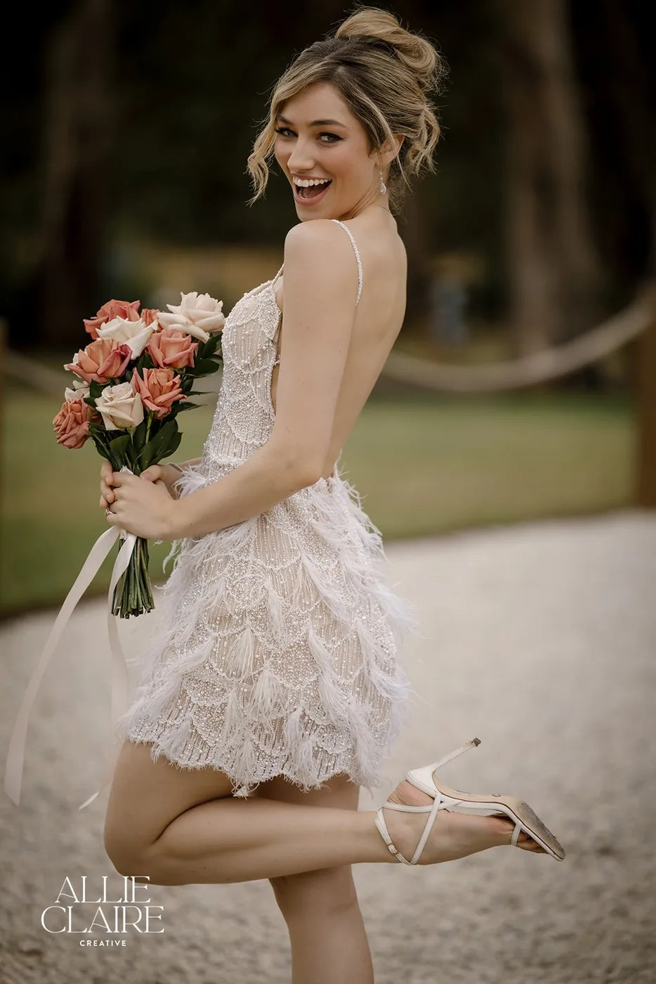 Bride holding her bouquet on the path to the ceremony