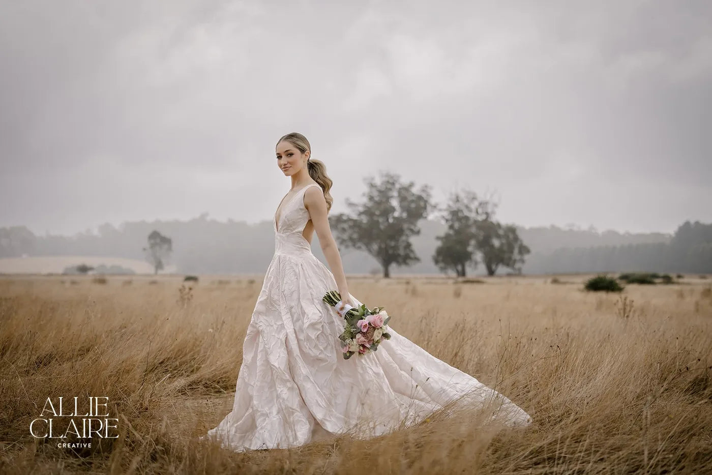Bride in an open field on her wedding day