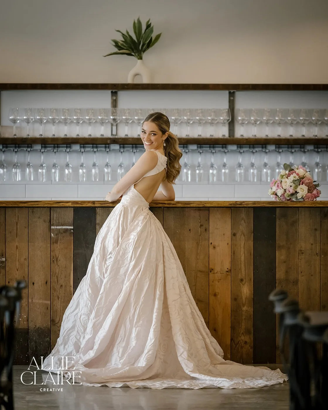 Back detail of the gown, hair dressed low