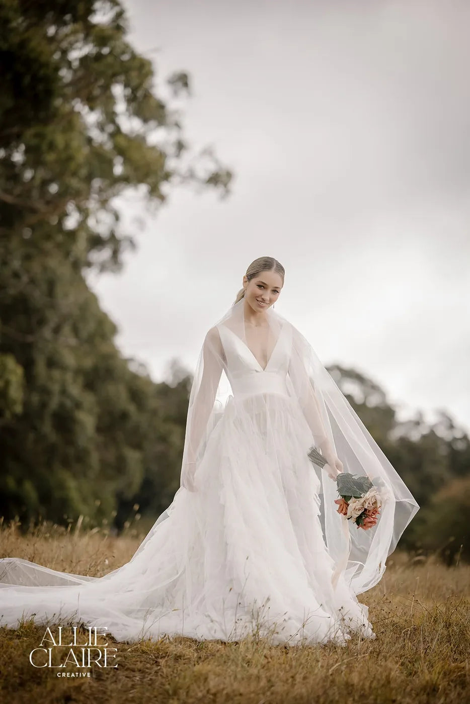 Full-length veil trailing across the field