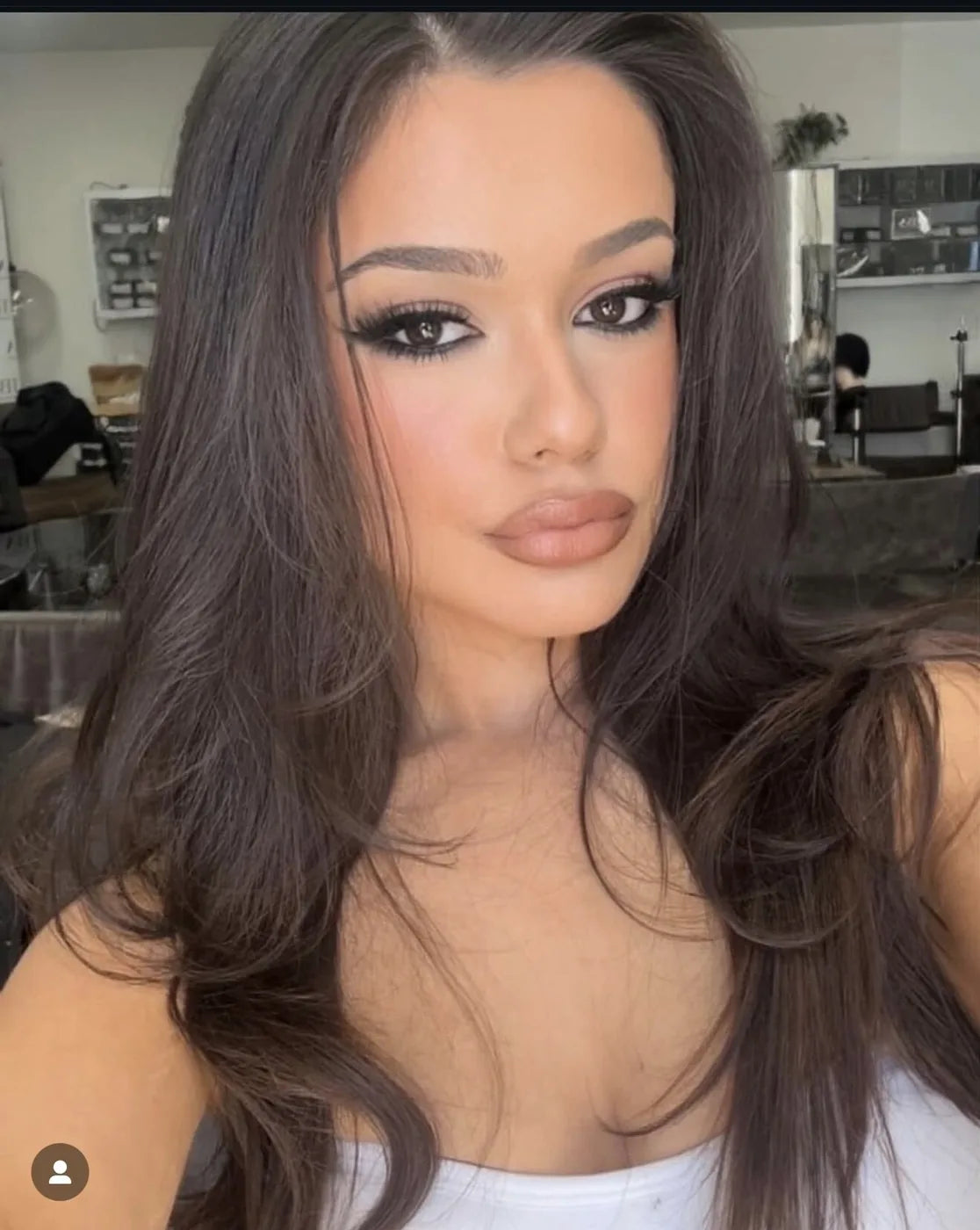 Sun-kissed skin with a soft smoky eye